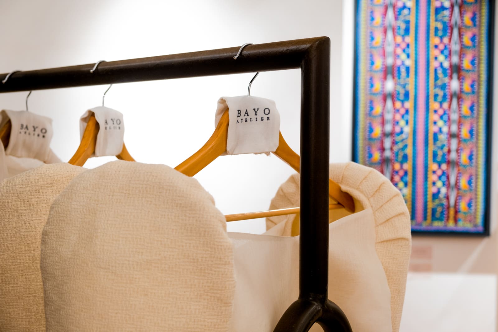 BAYO Atalier Filipiniana ternos displayed on a rack