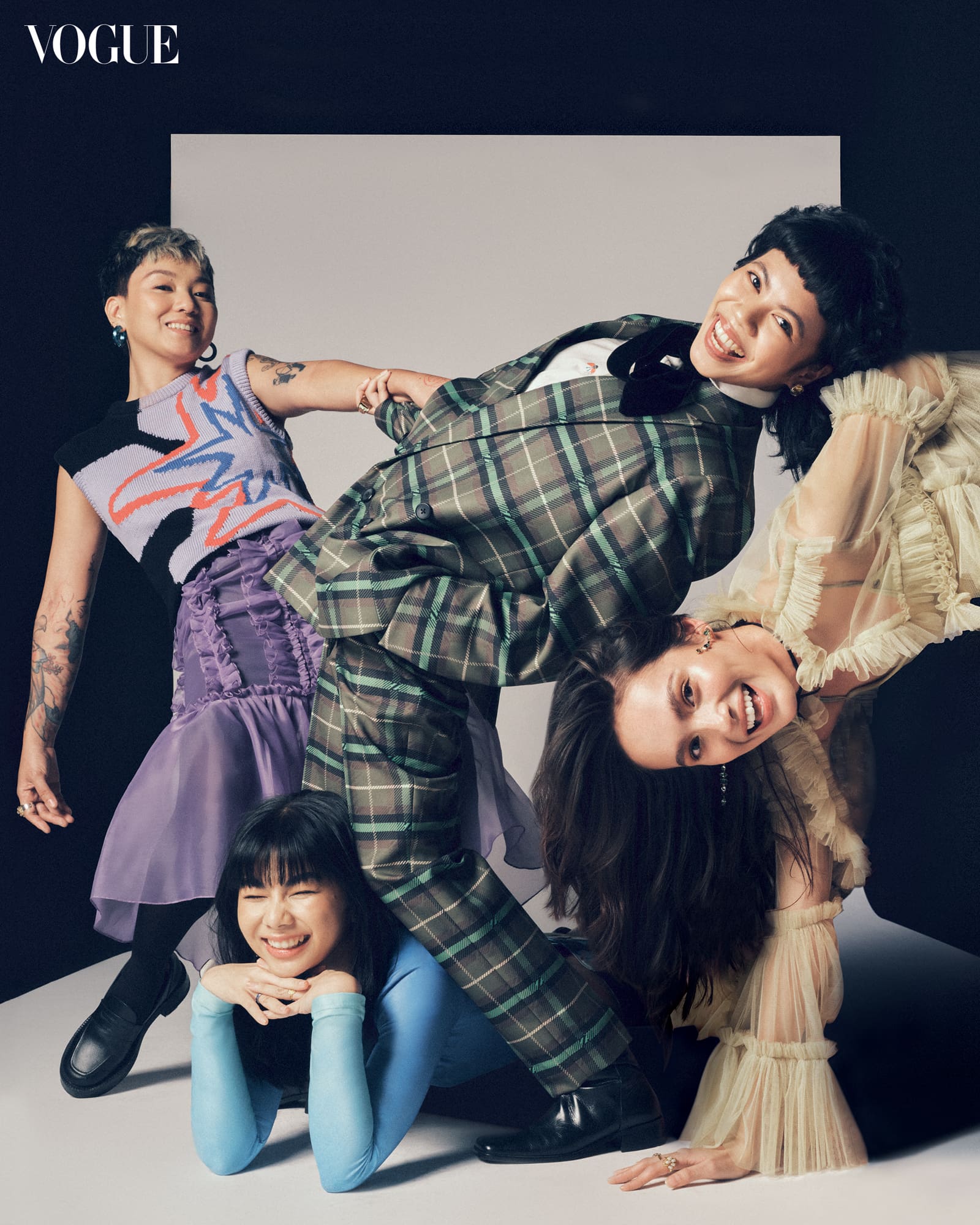 Brisa Amir wears a PAUL SMITH knit vest, MARTIN BAUTISTA tulle ruffled skirt, ANDANTÉ chunky loafers, SWAROVSKI lucent geometric hoops in pink, Gianne Encarnacion wears a RANDOLF cutout bodysuit, PAUL SMITH skirt, SWAROVSKI blue ring, SASSA JIMENEZ velvet bow heels, Daphne Chao wears a ZIGGY SAVELLA checked blazer and trousers, PAUL SMITH printed button-down, GUCCI velvet bow, Siobhan Moylan wears a MARTIN BAUTISTA tulle top, IT’S VINTAGE yellow camisole, AVAVAV printed mesh leggings from AKIMBO, SASSA JIMENEZ block heels.