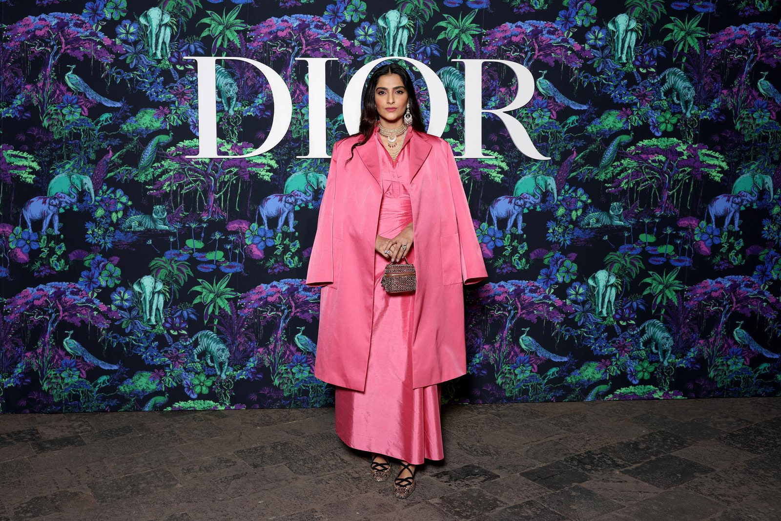 Dior Fall/Winter 2023 Show In Mumbai Sonam Kapoor wore a Dior Pre Fall 2023 pink silk coat, shirt and skirt.