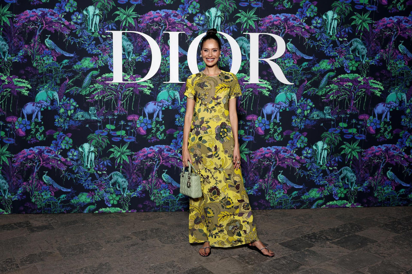 Dior Fall/Winter 2023 Show In Mumbai Ujjwala Raut wore a Dior Pre Fall 2023 printed yellow embellished dress with a Dior bag and shoes.