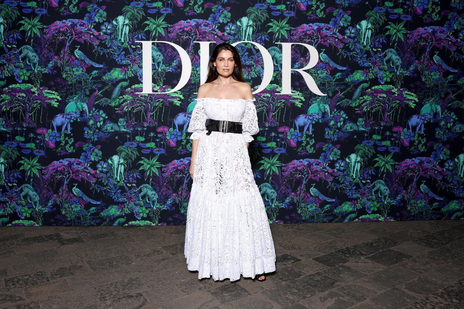 Dior Fall/Winter 2023 Show In Mumbai Laetitia Casta wore a Dior Cruise 2023 white lace cotton dress.