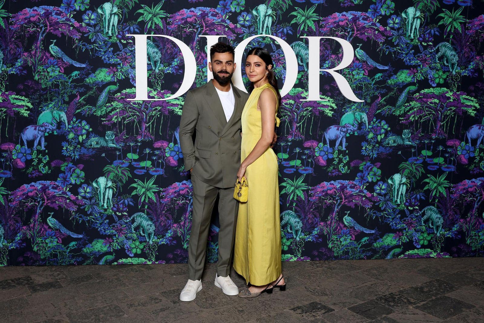 Dior Fall/Winter 2023 Show In Mumbai Anushka Sharma wore a Dior Pre Fall 2023 yellow silk dress.