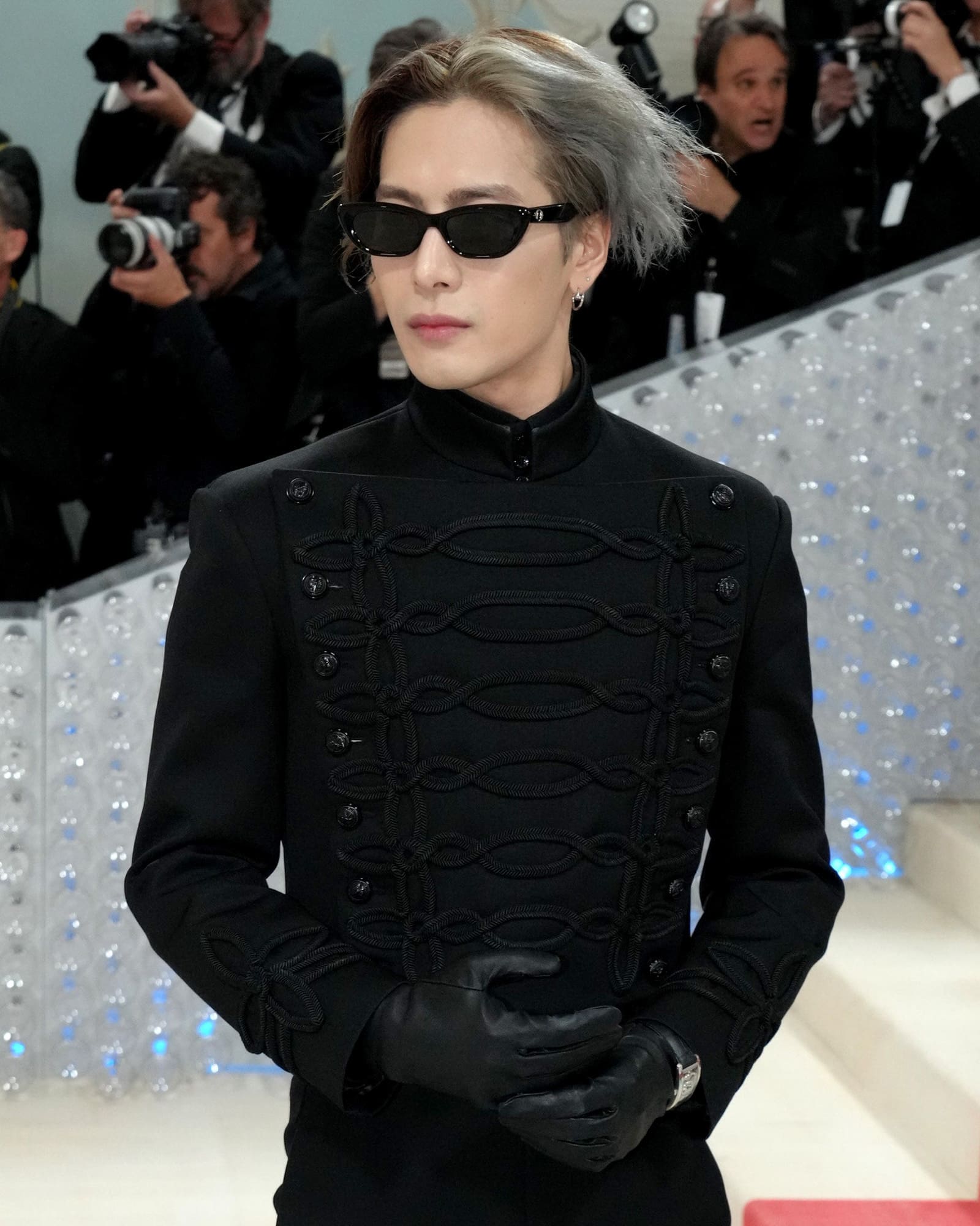 Jackson Wang all-black Louis Vuitton ensemble, which is edged up with Cartier Juste en Clou earrings, the Cartier skeleton wristwatch, and the Panthère de Cartier ring in met gala 2023