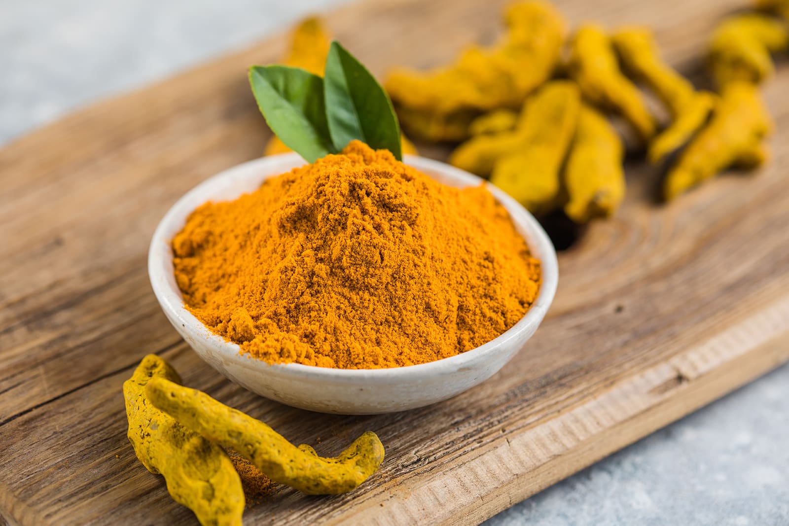 Ayurvedic ingredients Indian turmeric powder and root. Turmeric spice.