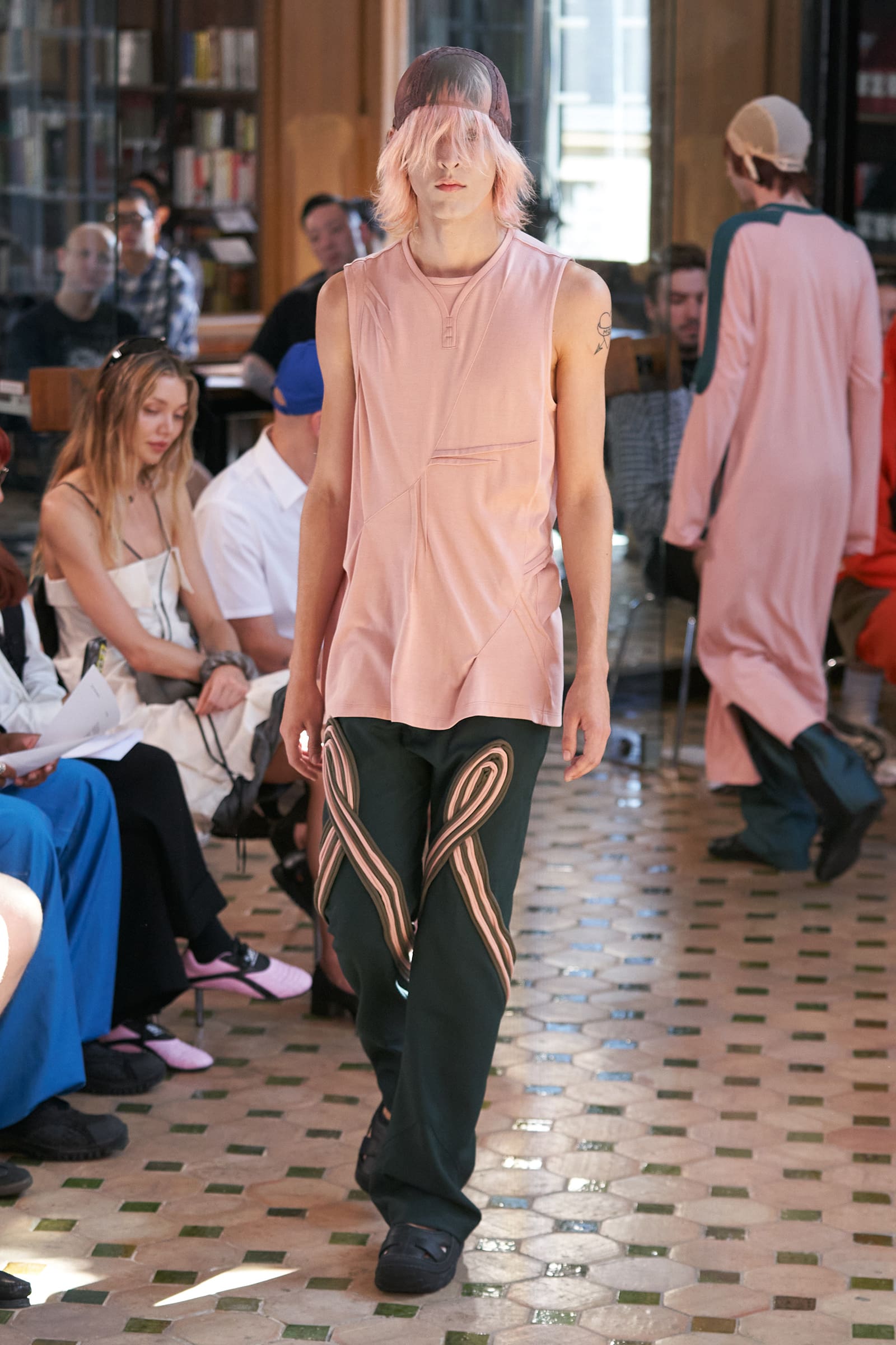 This Kiko Kostadinov, spring 2024 menswear tank top has around 15 darts and seams.