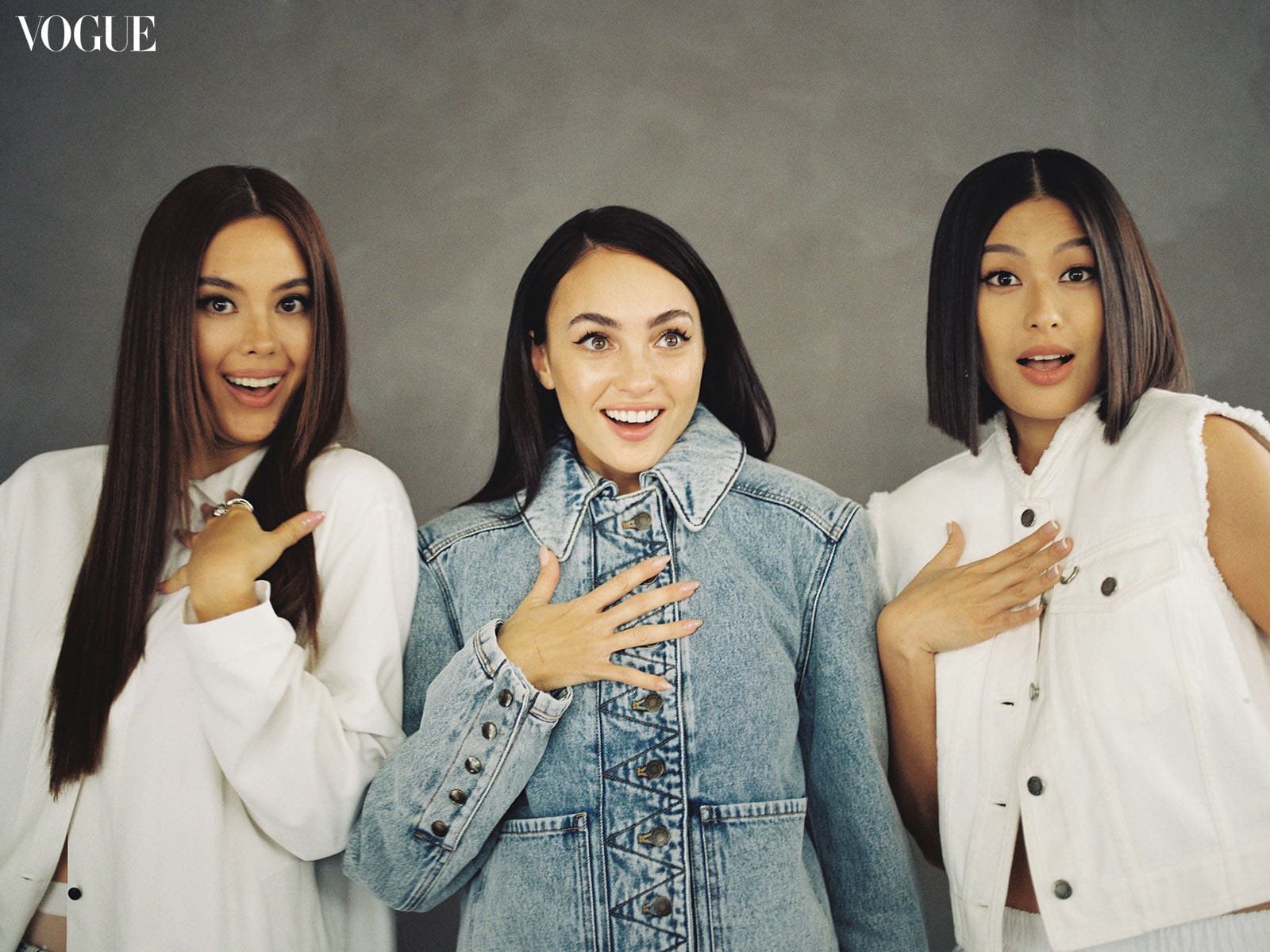 Catriona Gray, R'Bonney Gabriel, and Michelle Dee smiling and surprised