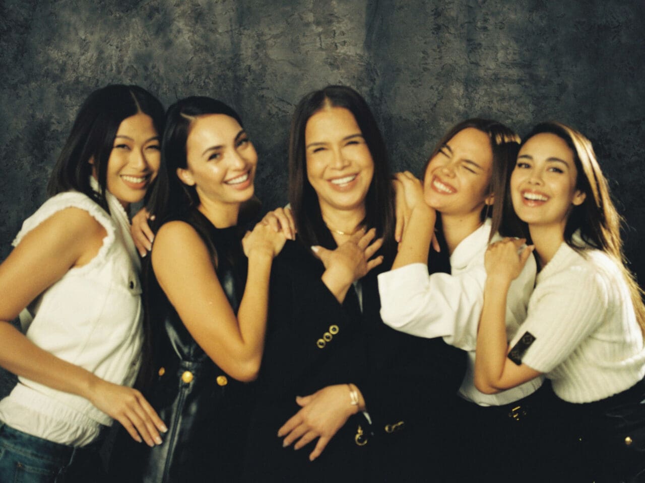 Megan Young, Melanie Marquez, Catriona Gray, R'Bonney Gabriel, and Michelle Dee laughing and smiling