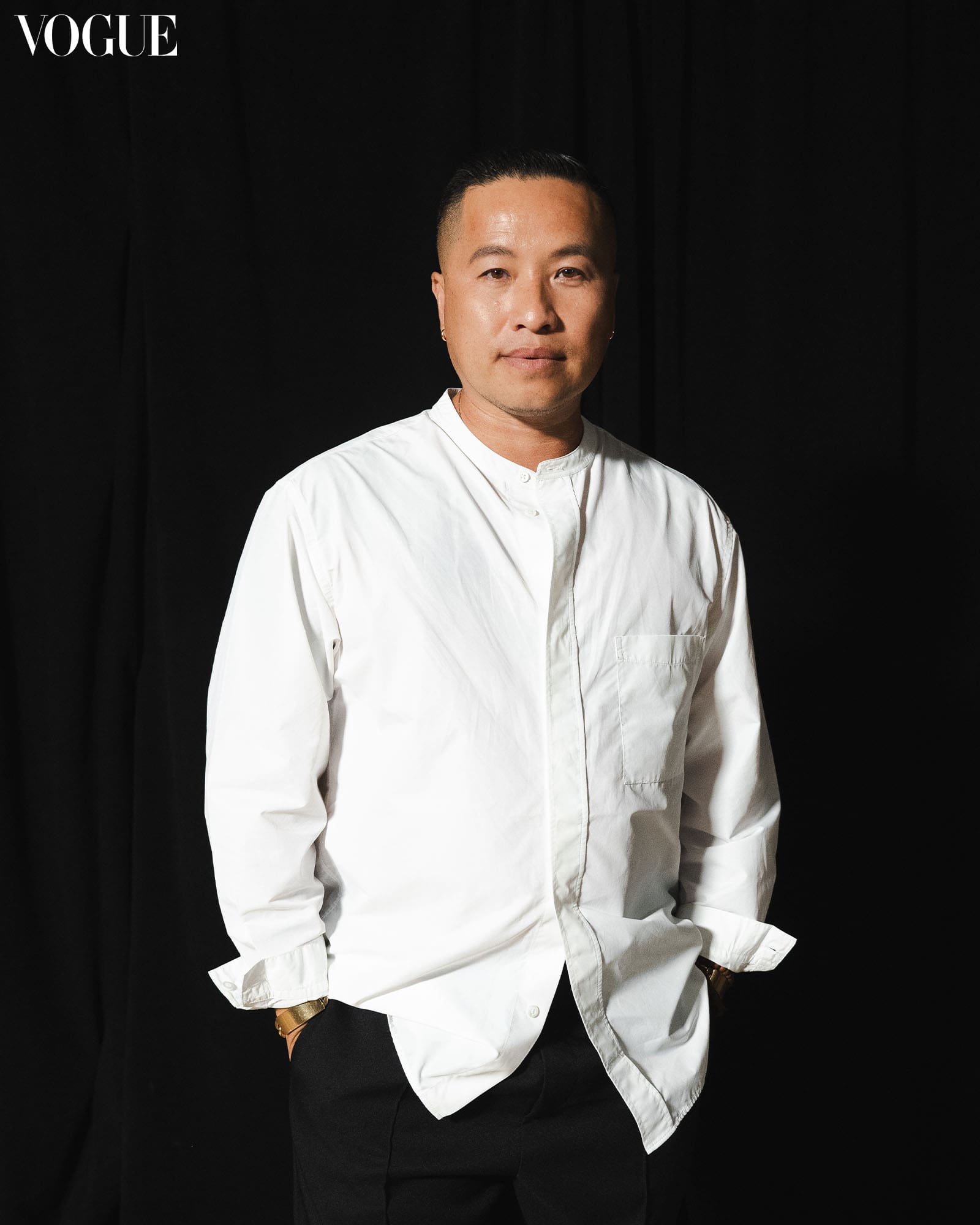 Philip Lim wearing a white button down shirt