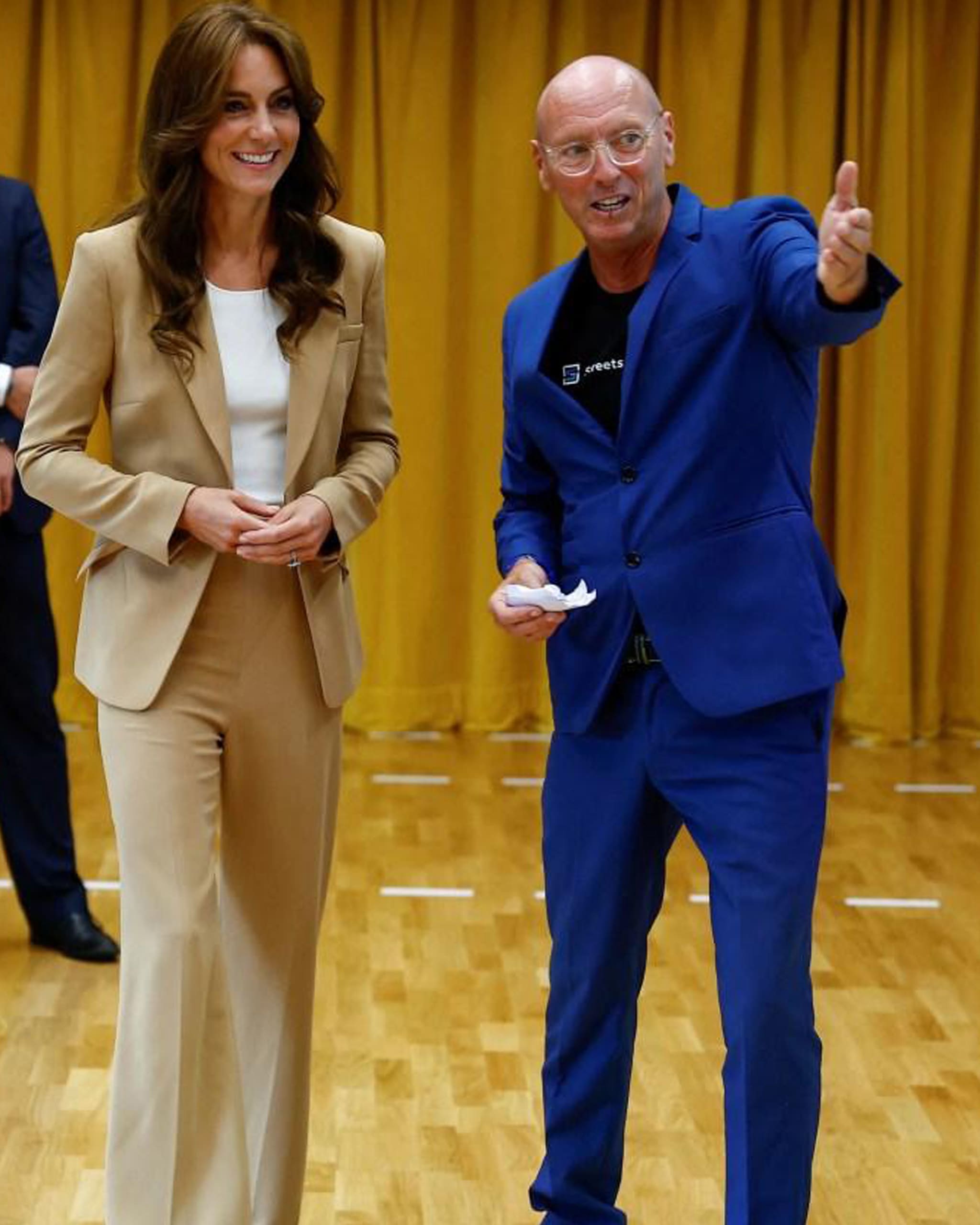 Woman wearing a brown suit and pants terno with a guy in blue suit and pants terno.
