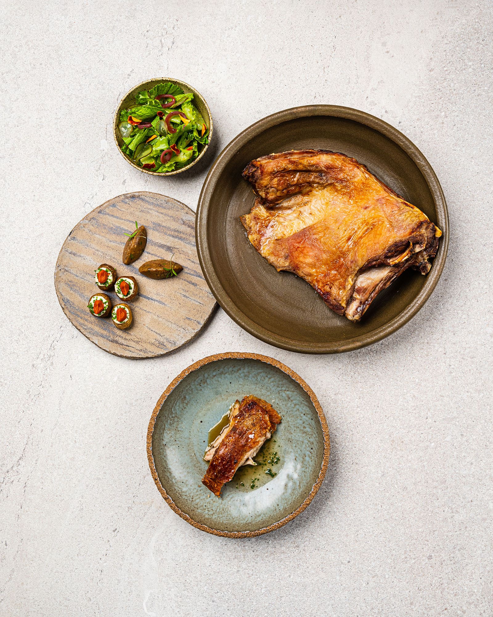 Lamb with patatas bravas and rich eggplant caviar.