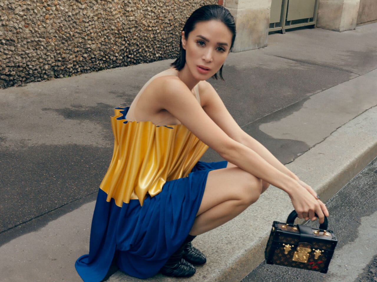 Heart Evangelista wearing a Louis Vuitton two-tone draped top and Petite Malle Capitale.