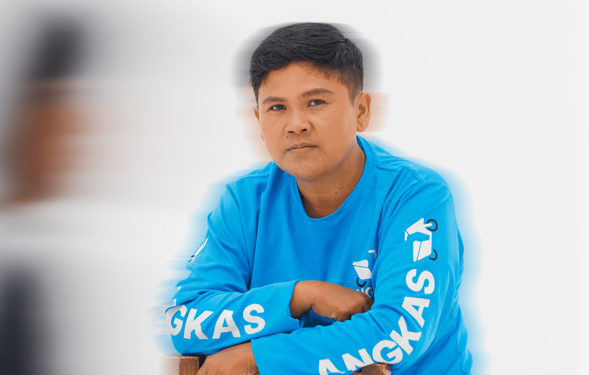 Melody Viray wearing Angkas' blue trademark long-sleeve shirt.