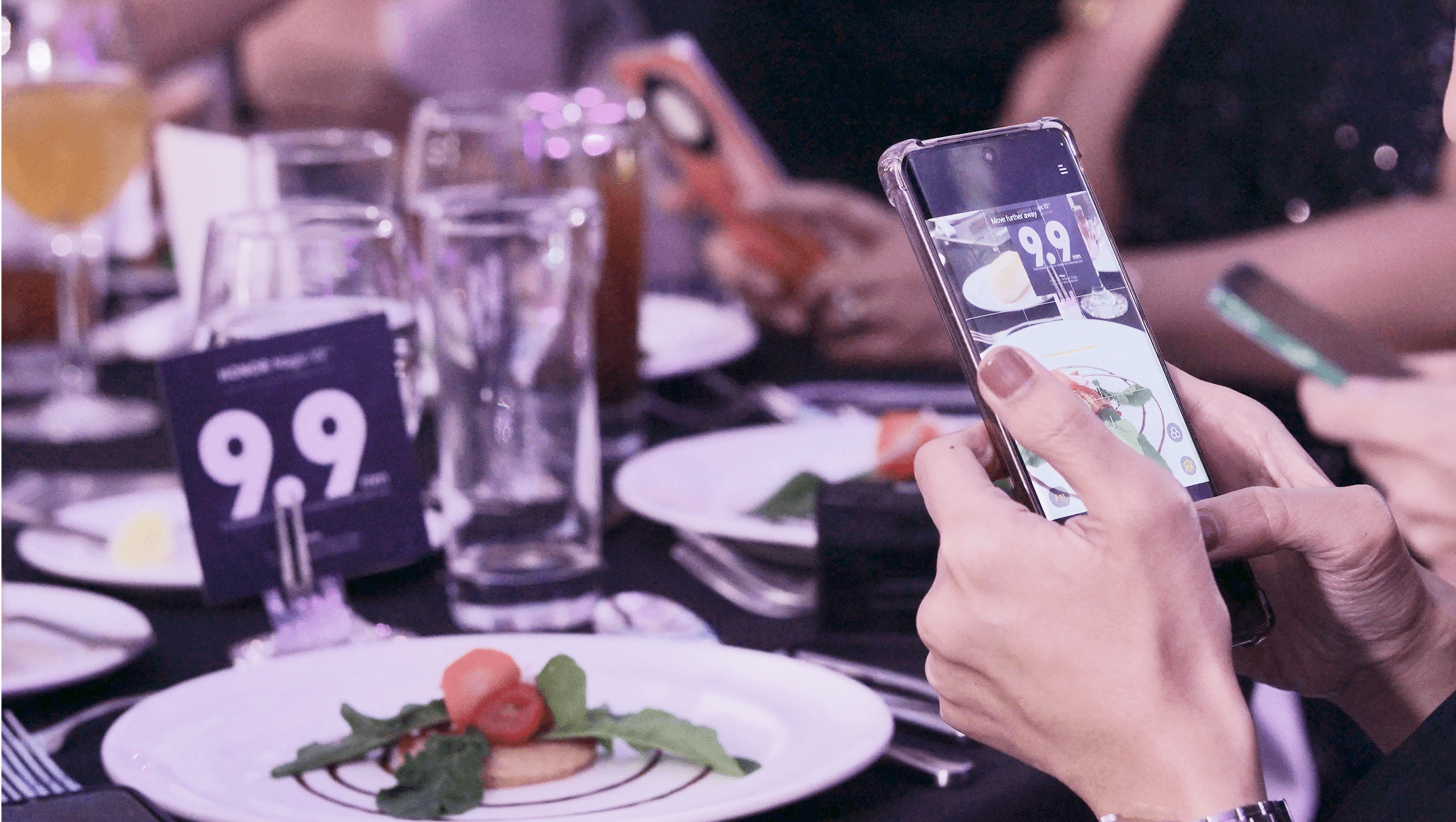 A guest taking photos of the food