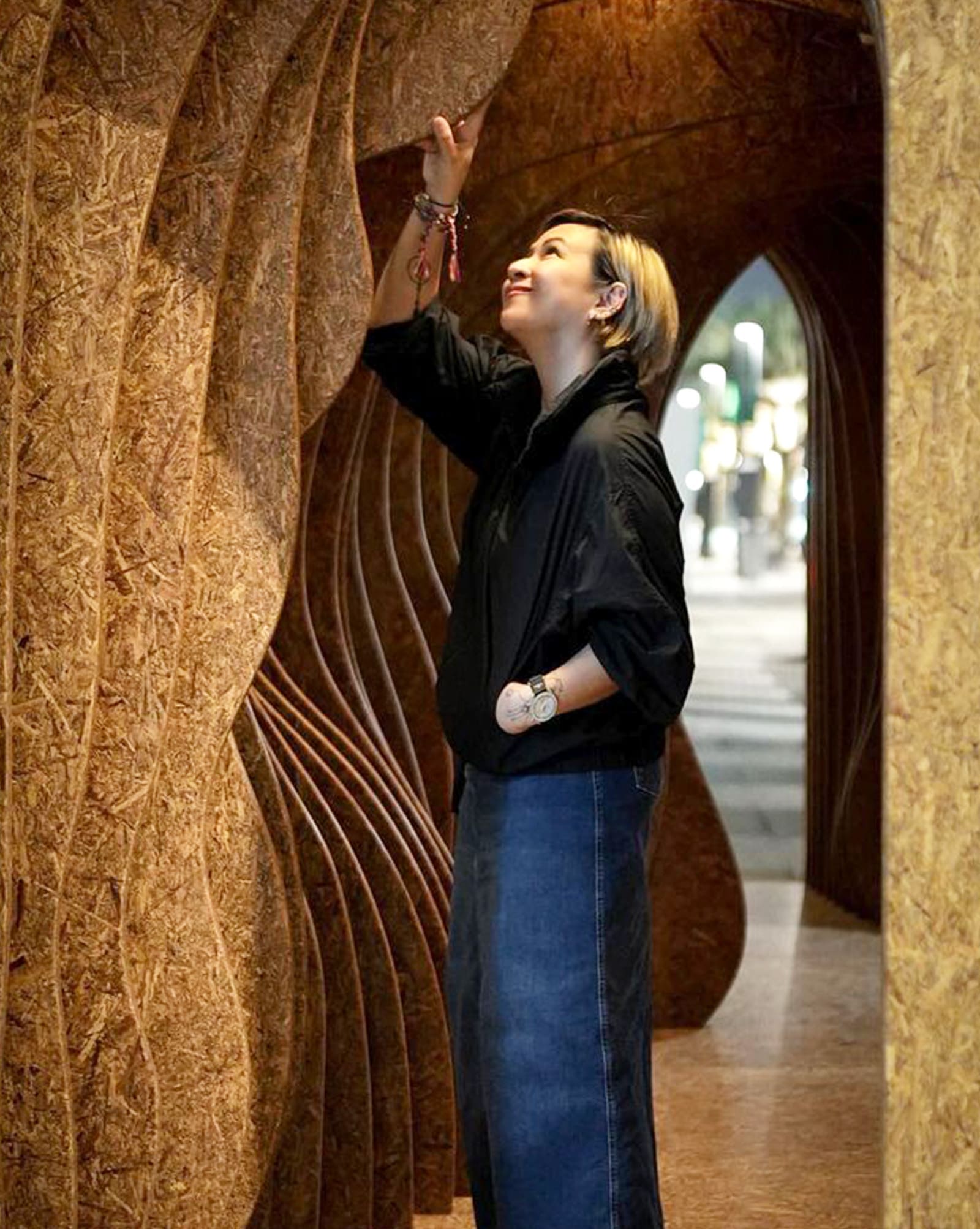 Kitty Bunag interacting with a cork design piece