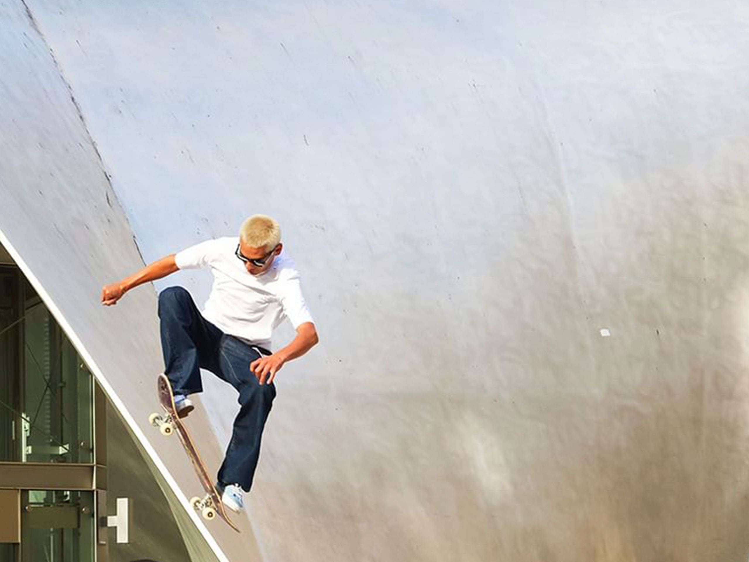 evan mock for maui jim | vogue philippines Evan Mock skateboarding wearing black Maui Jim sunglasses
