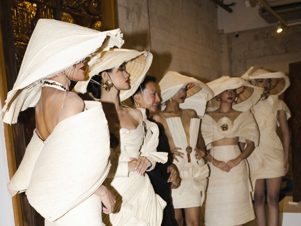 group of models wearing a woven white and black dress from bohol saguran weaving