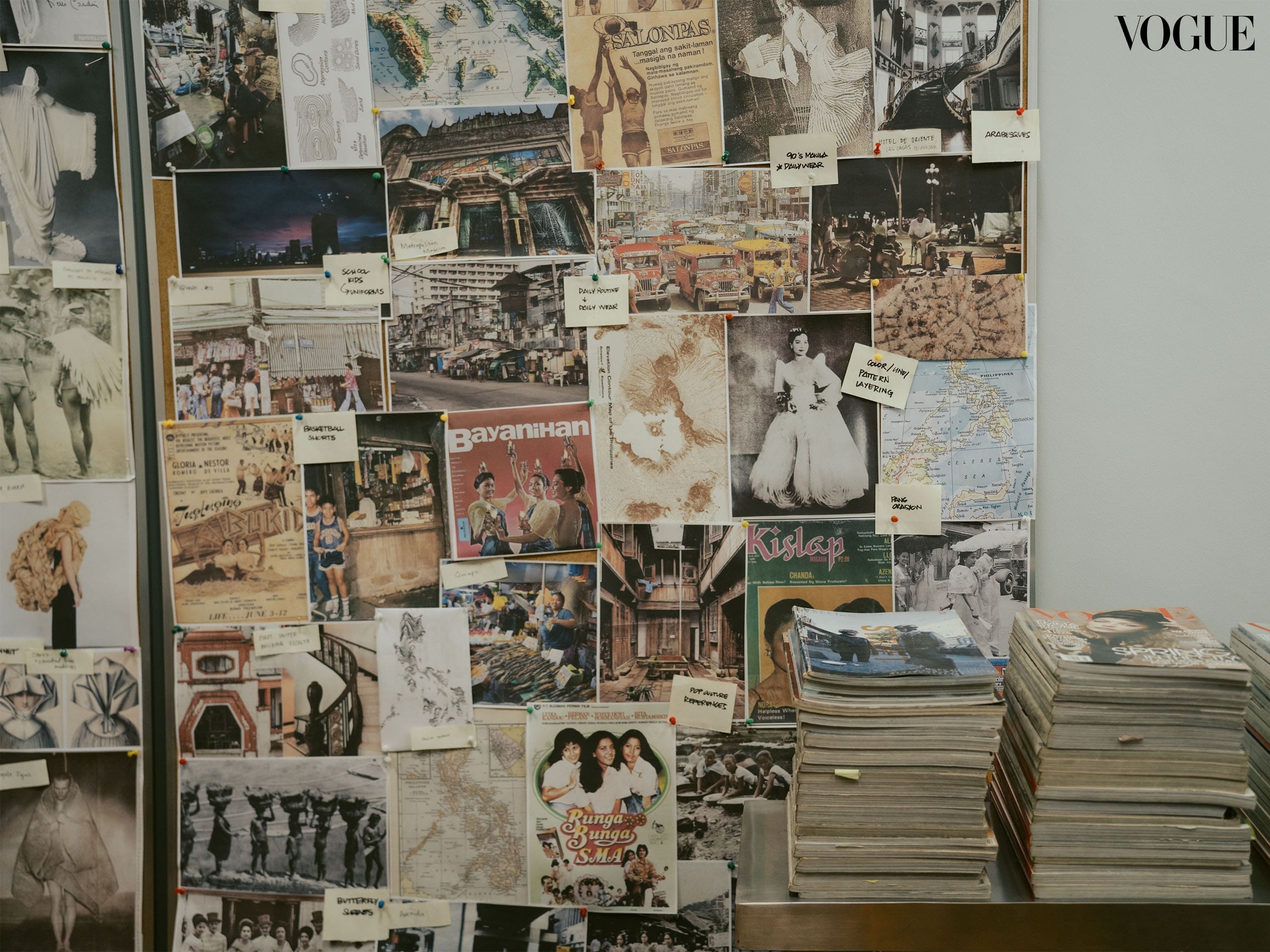 Floor-to-ceiling mood boards and fashion magazines across decades line one of the rooms in the Carl Jan Cruz atelier. Photographed by Kim Santos