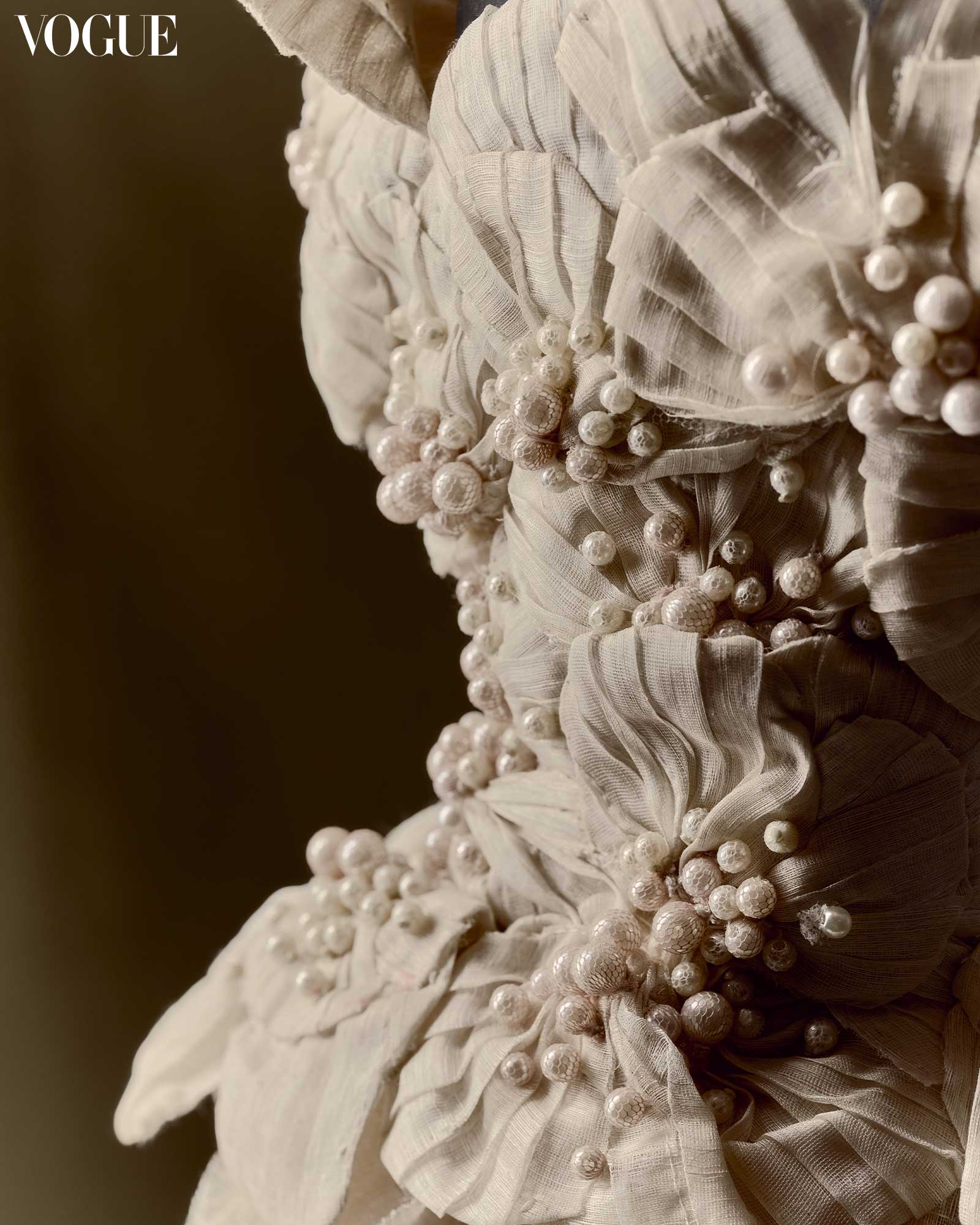 Close up of Mark Bumgarner floral pearl piña and abaca textiles dress