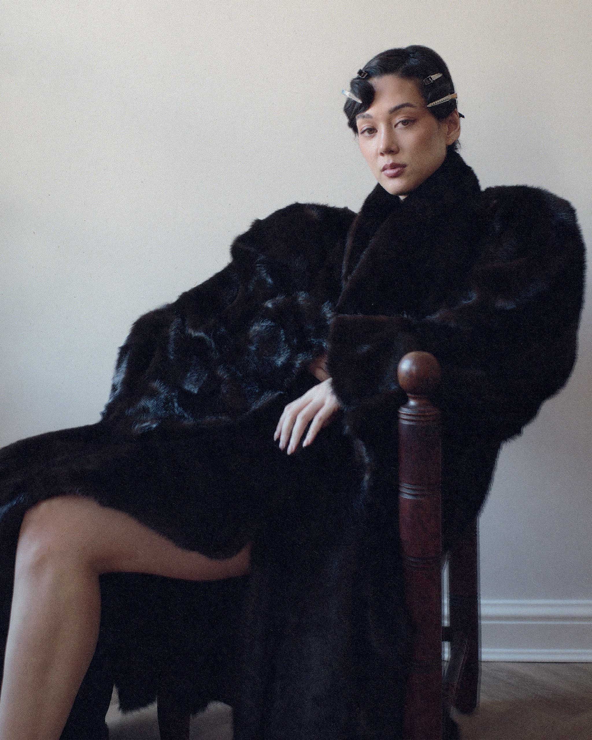 Kim Jones Vogue Philippines portrait black coat sitting on a chair