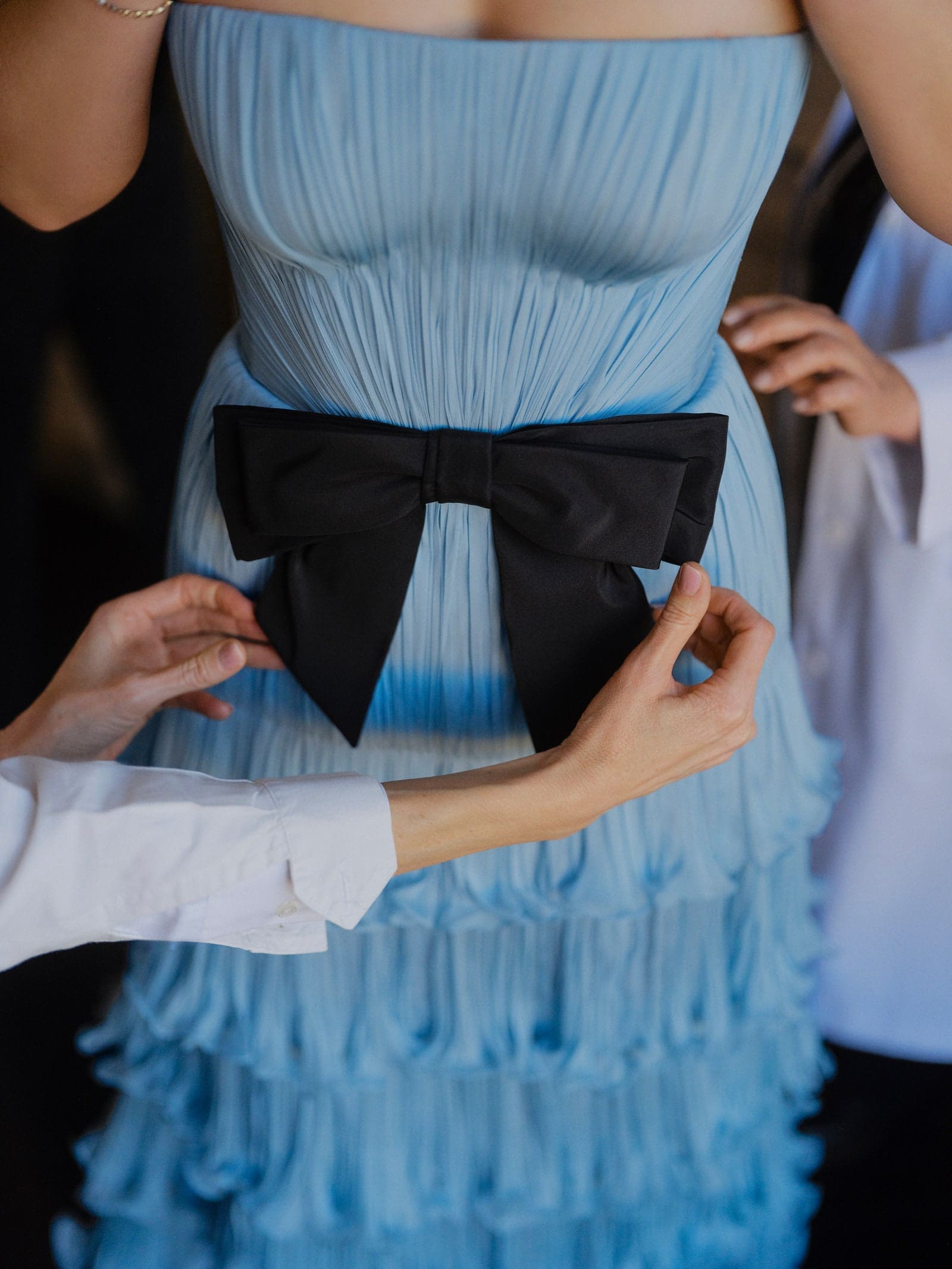 blue valentino gown with black bow for apple martin
