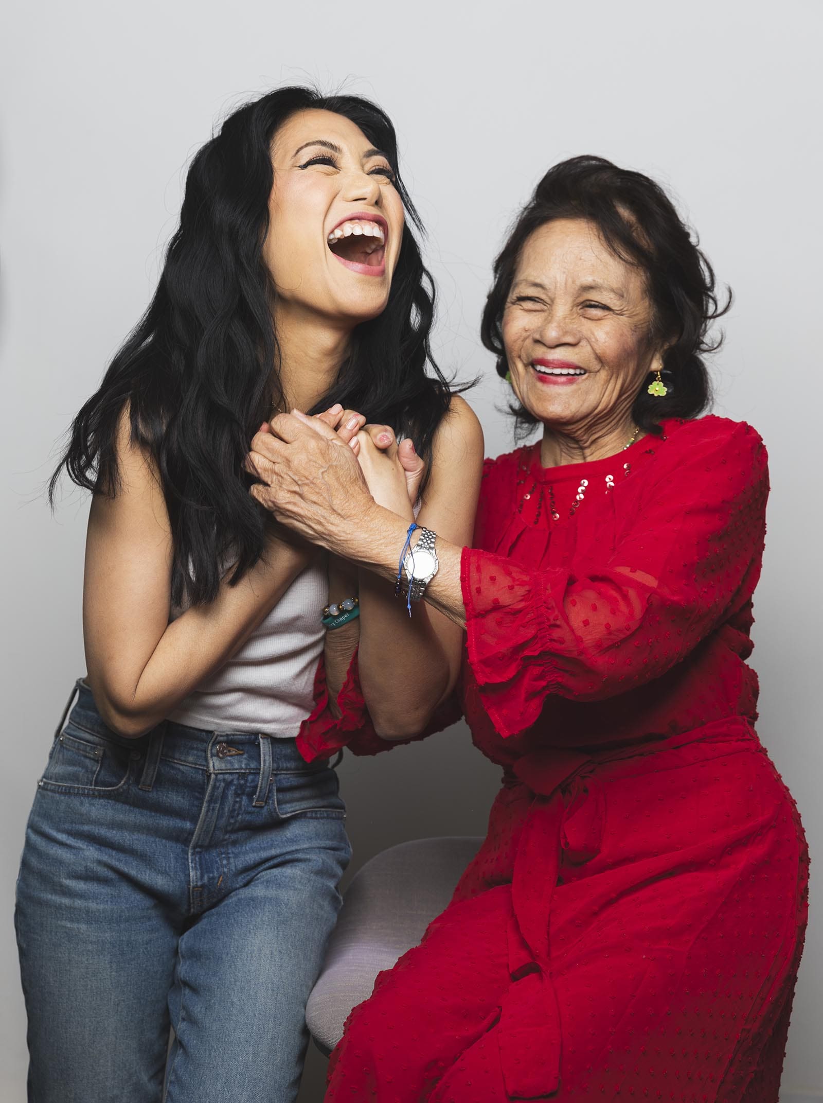 Liza Lapira laughing with her mother, Lourdes Lapira.