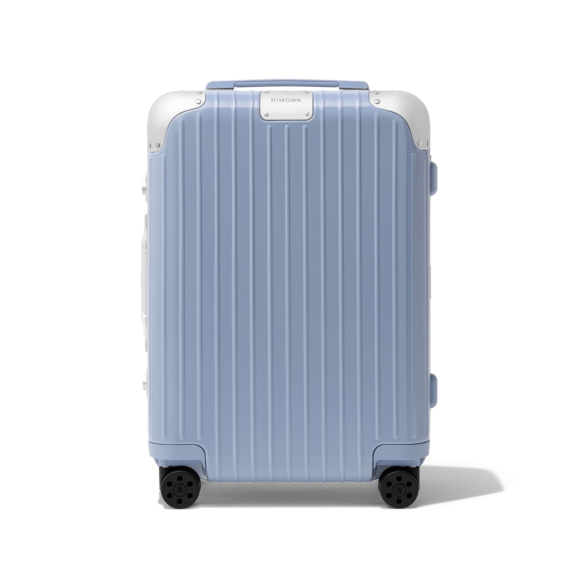 rimowa hybrid cabin in lilac | vogue philippines