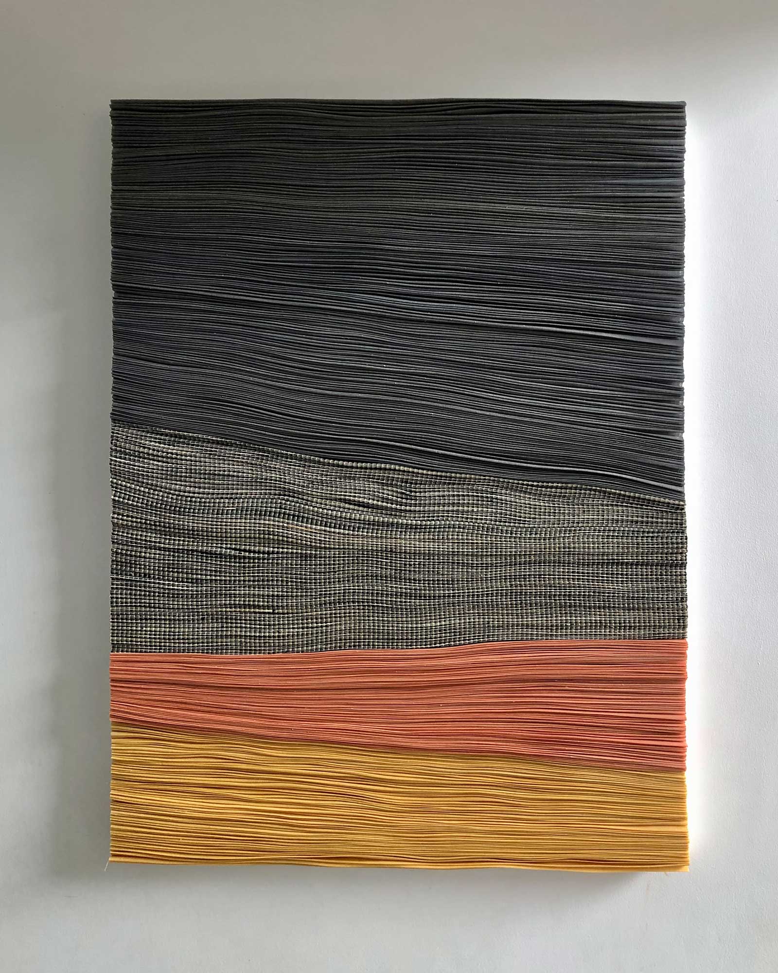 Artwork by Olivia d'Aboville entitled Landforms I, consisting of 12 yards of pleated handwoven textile (abaca, raffia, polyester)