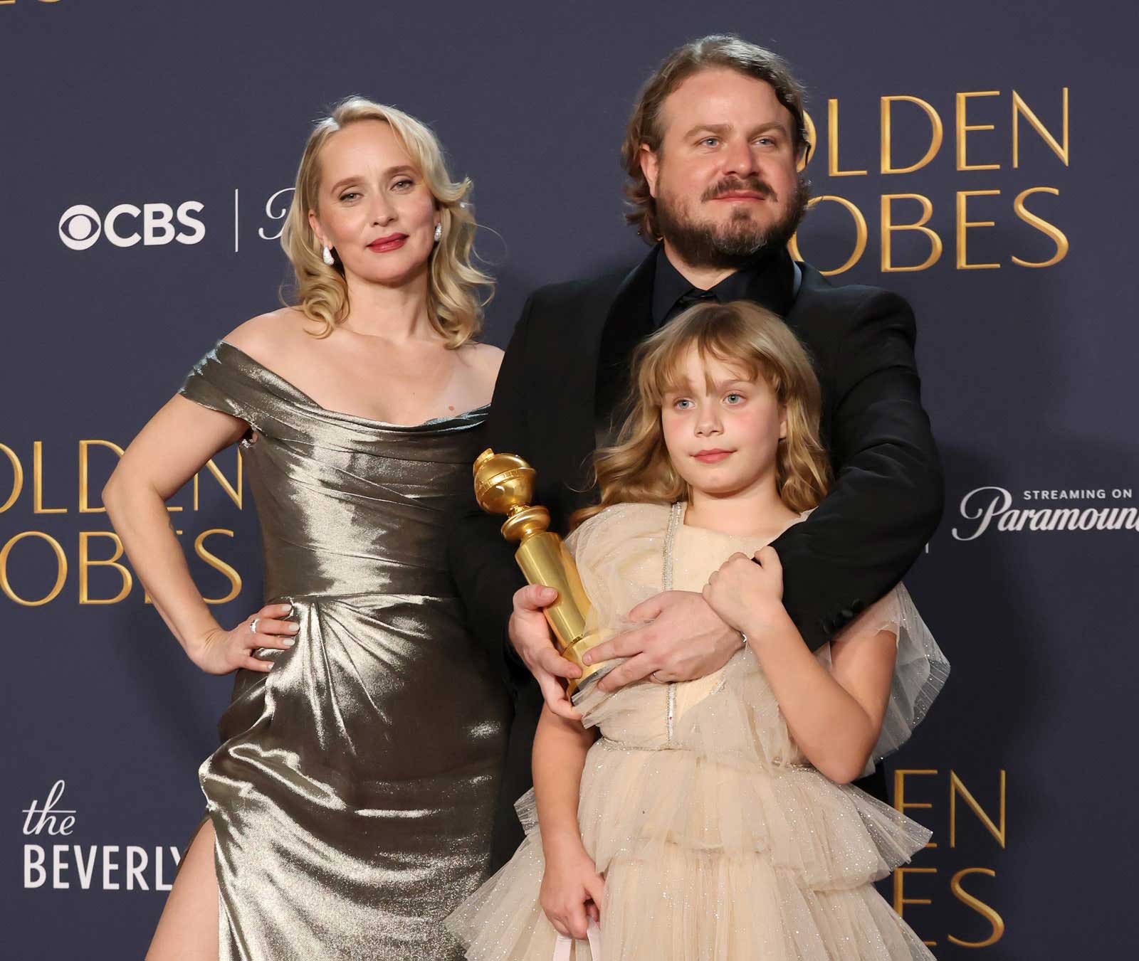 A photo of screenwriter Mona Fastvold, director and screenwriter Brady Corbet, and their daughter.