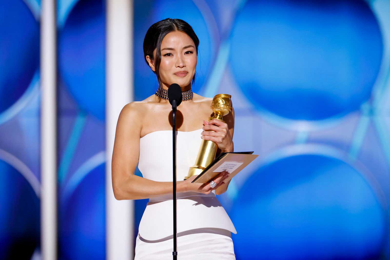 Photo of Actress Anna Sawai holding her Golden Globe after winning the award for her role in 