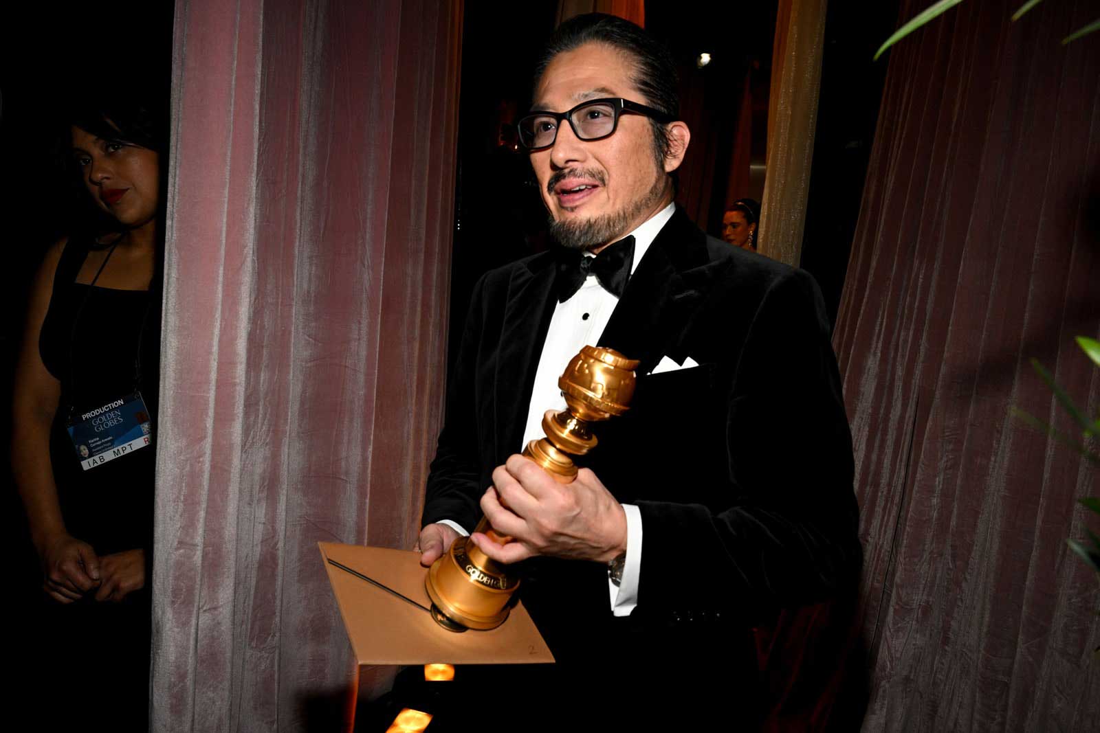 Actor Hiroyuki Sanada holding his Golden Globe award after winning it for his role in 