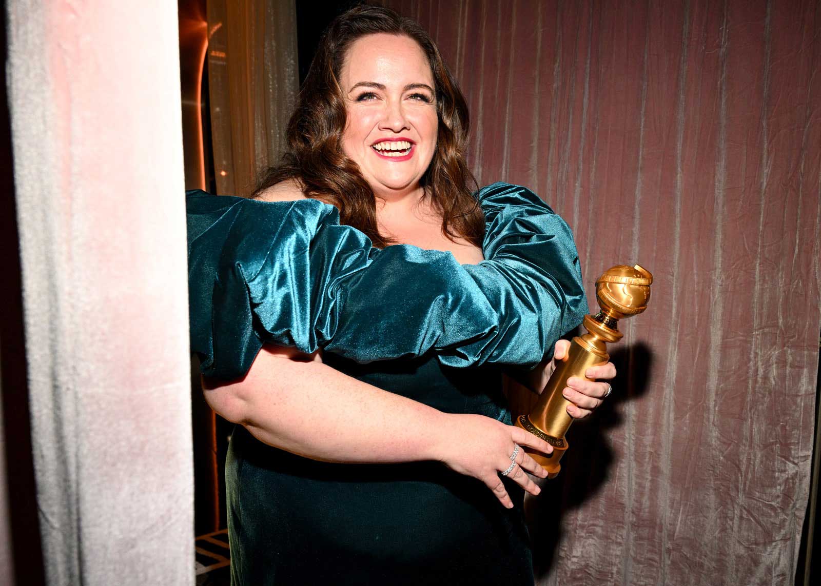 Actress Jessica Gunning holding her Golden Globe after winning the award for 