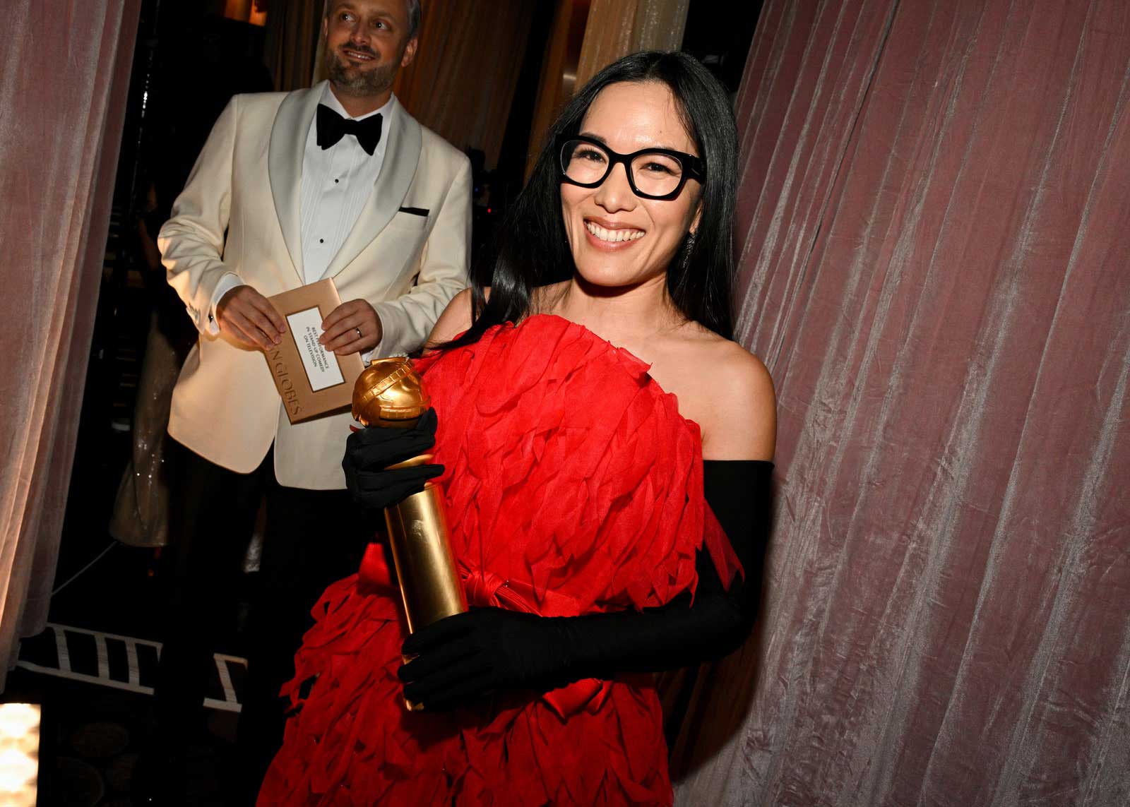 Comedian and actress Ali Wong holds her Golden Globe after winning the award for Best Stand Up Comedian.