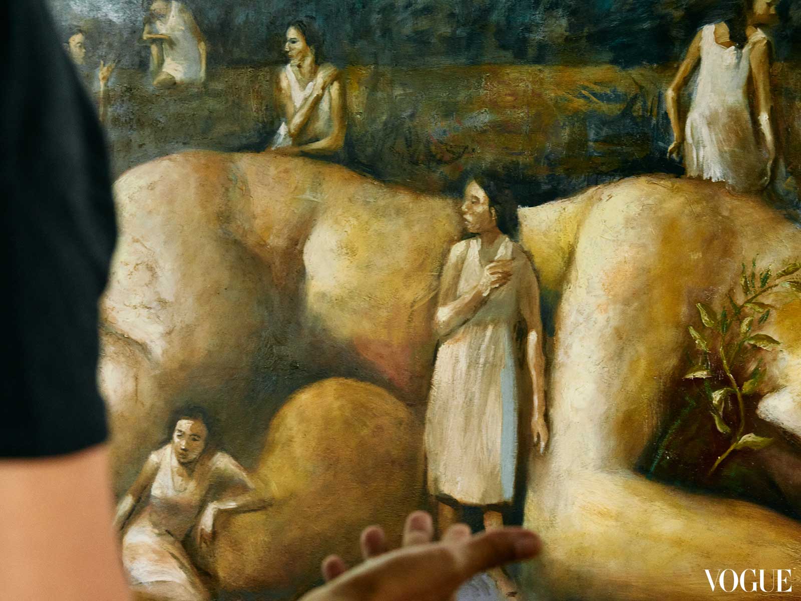 Close up photo of a painting depicting multiple women around a much larger figure of a woman asleep.